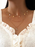 Gold Star and Moon Charm Necklace